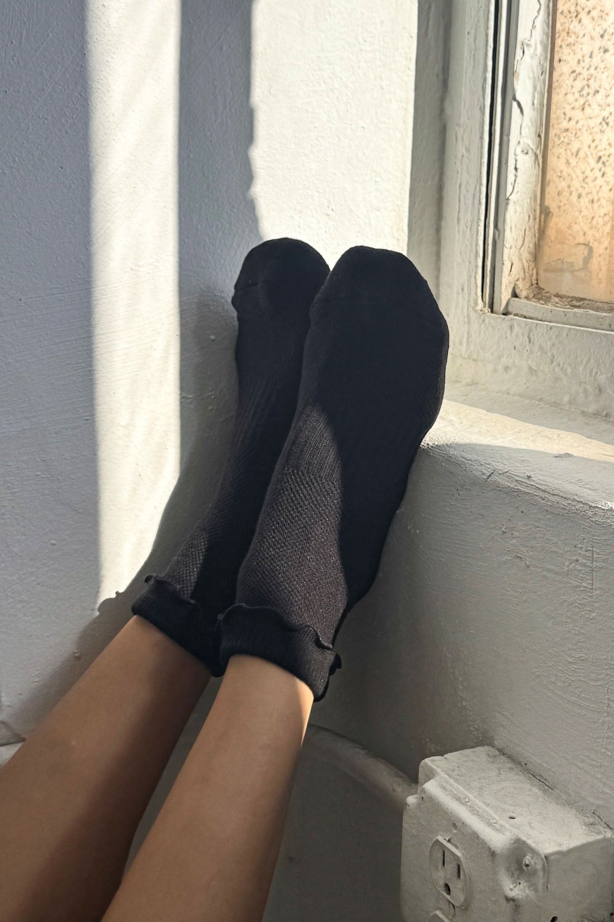 Le Bon Shoppe Black Ruffled Hugger Crew Socks - model on feet