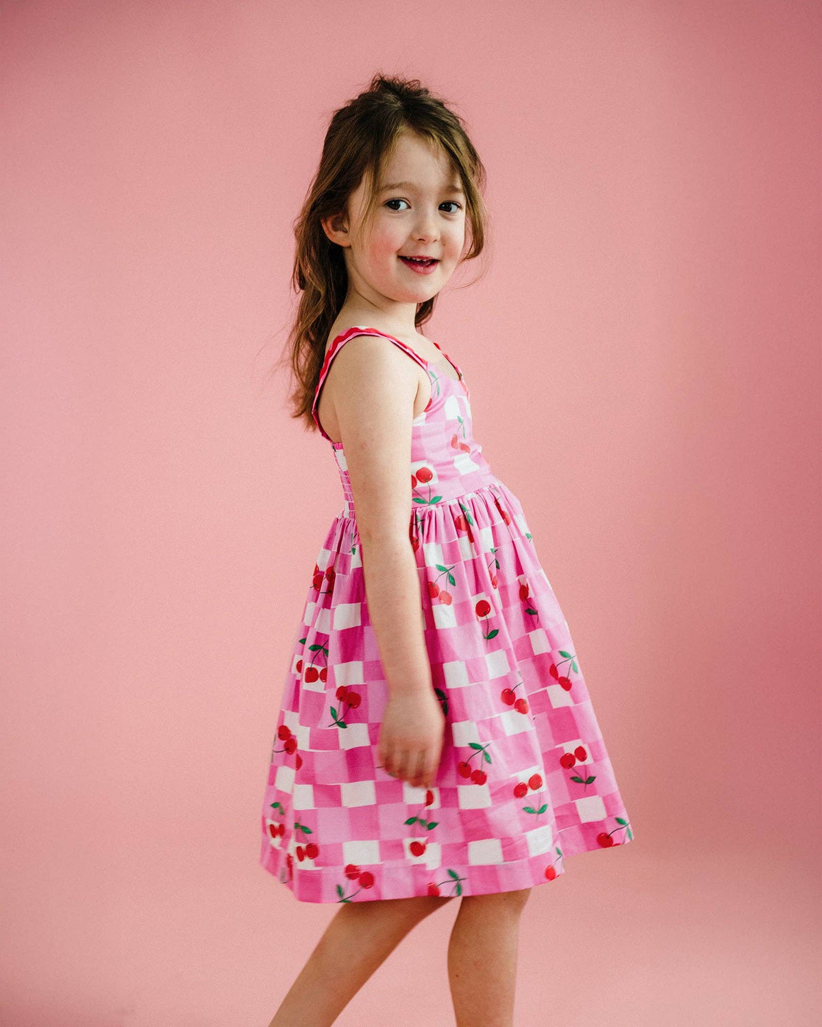Rock Your Baby - Gingham Cherry Picnic Dress — back view flat lay