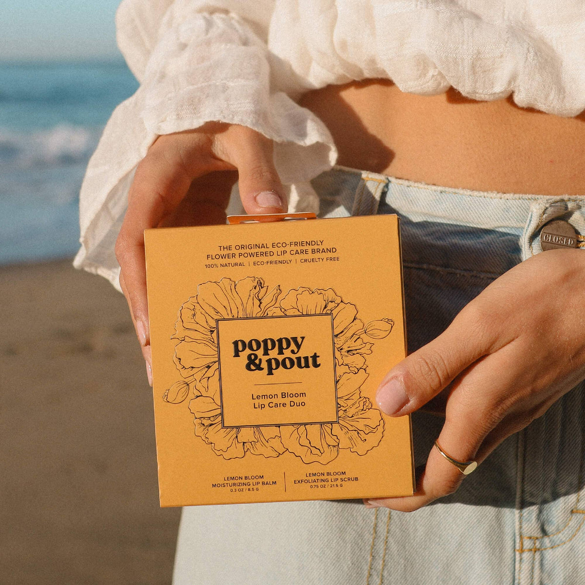 Poppy and Pout Lemon Bloom lip care duo - model using lifestyle