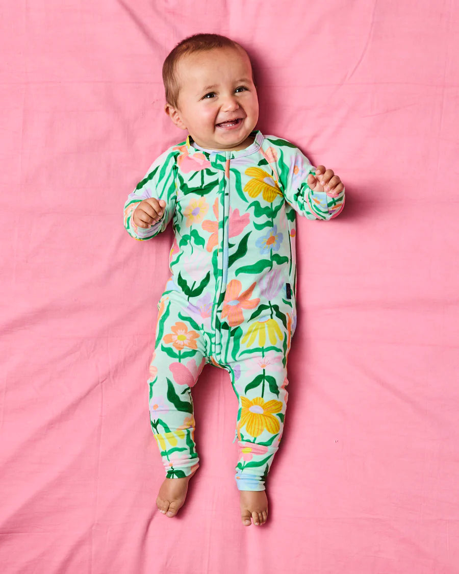 Kip and Co Popping Flowers zip romper - baby wearing lifestyle