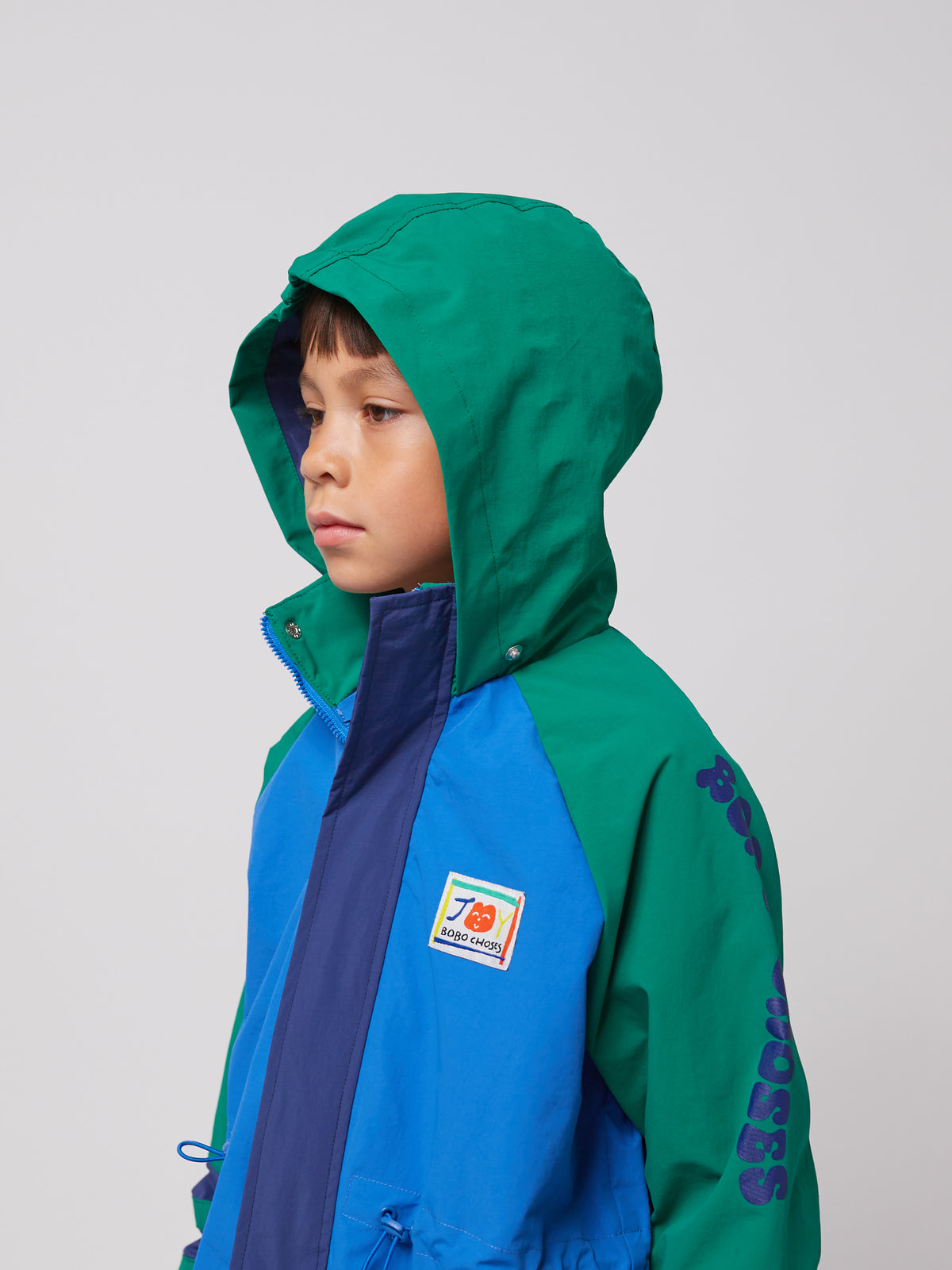 Bobo Choses - Wavy Colour Block raincoat SS25 — back view flat lay