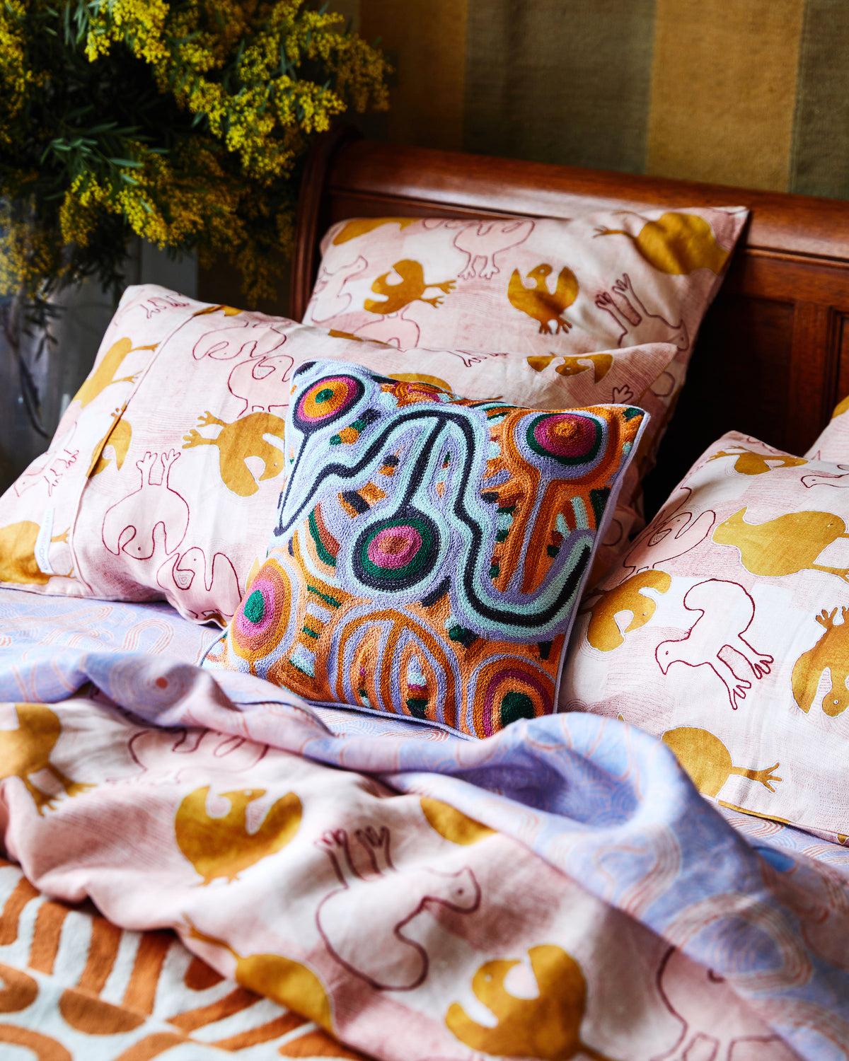 Kip and Co Ernabella Ngayuku Ngura cushion - styled on sofa