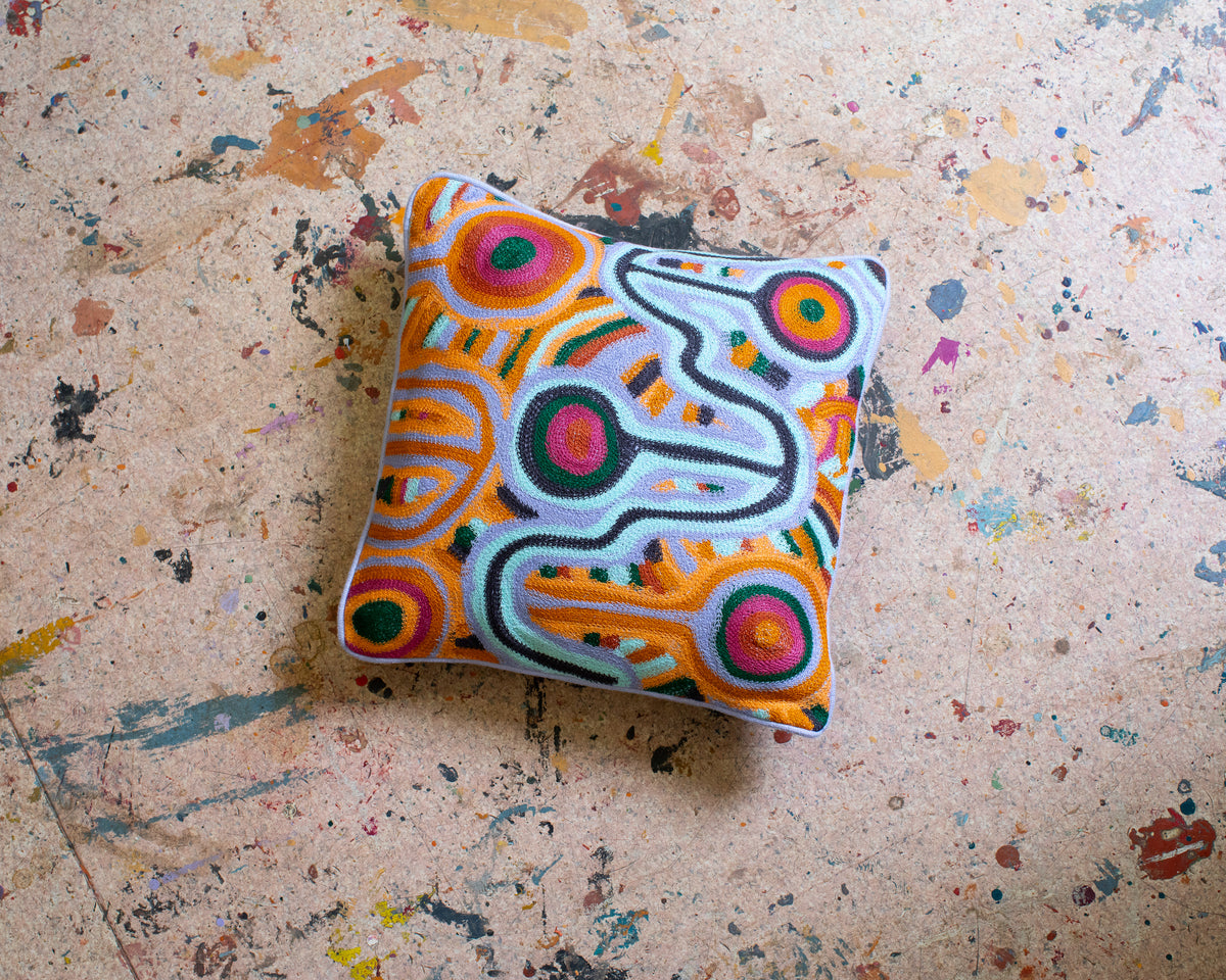 Kip and Co Ngayuku Ngura embroidered cushion - living room lifestyle