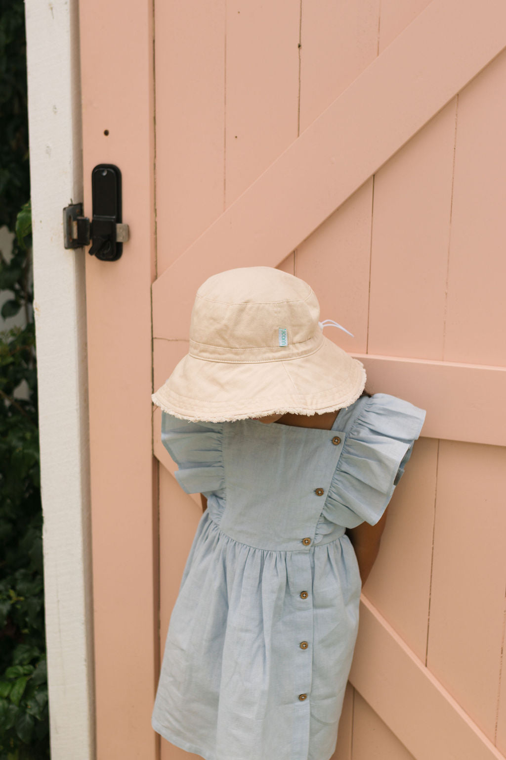 Acorn Vanilla Frayed Bucket Hat - front view on model