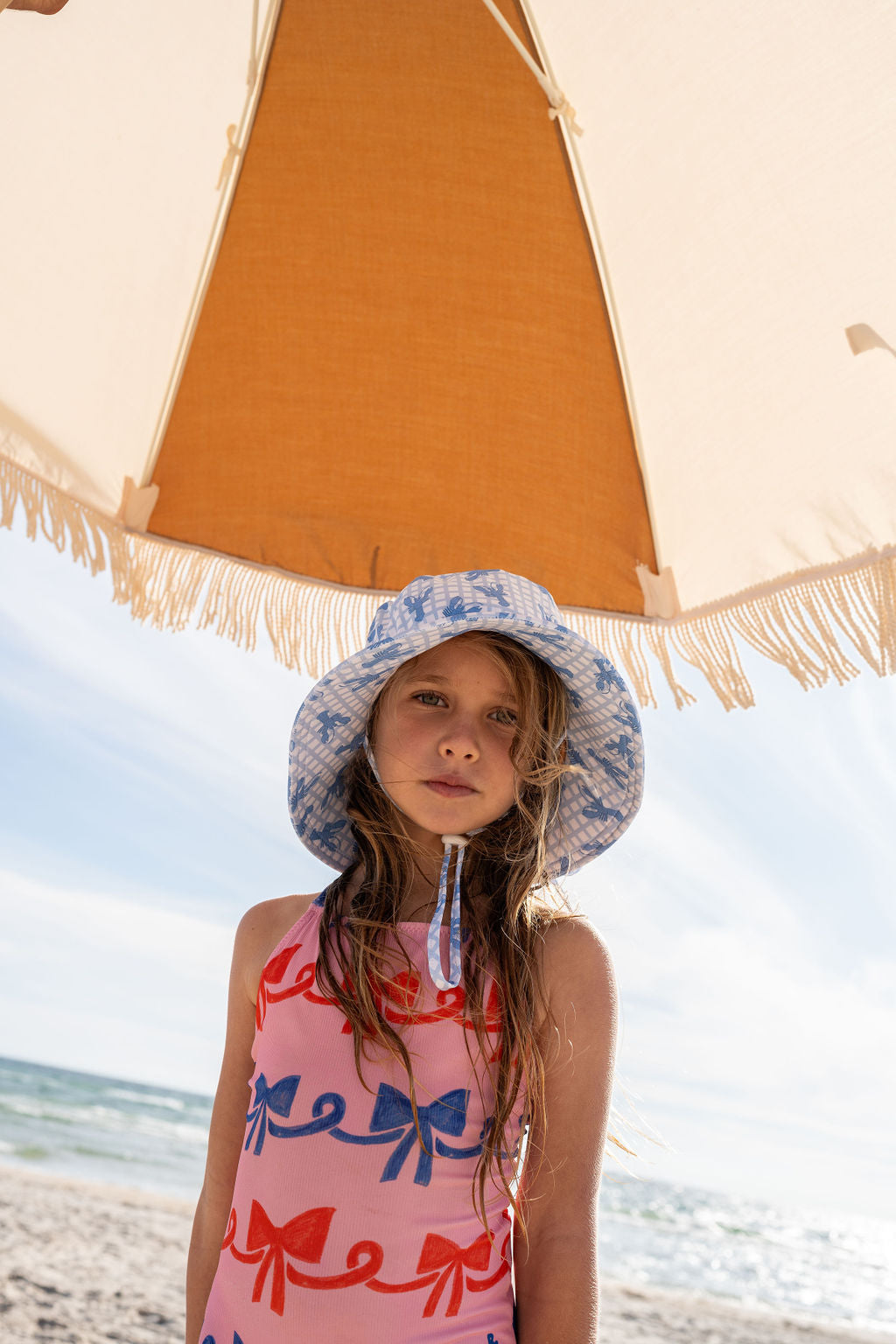 Acorn Blue Lobster Wide Brim Swim Hat - side view on child