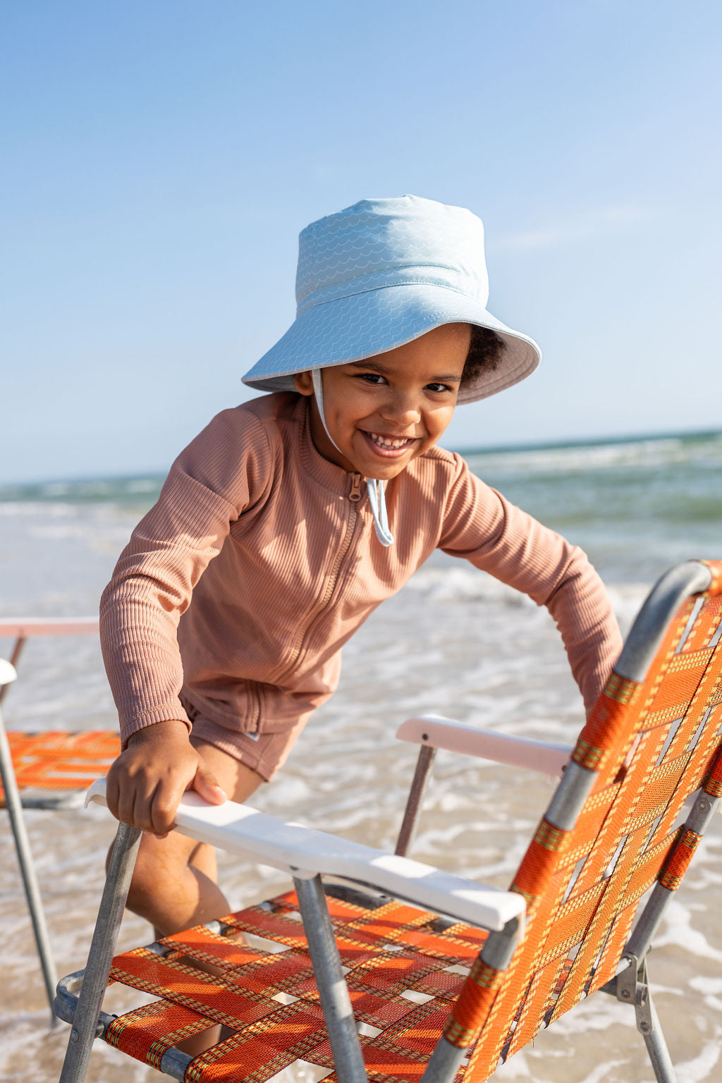 Acorn Blue Waves Wide Brim Swim Hat - side view on child