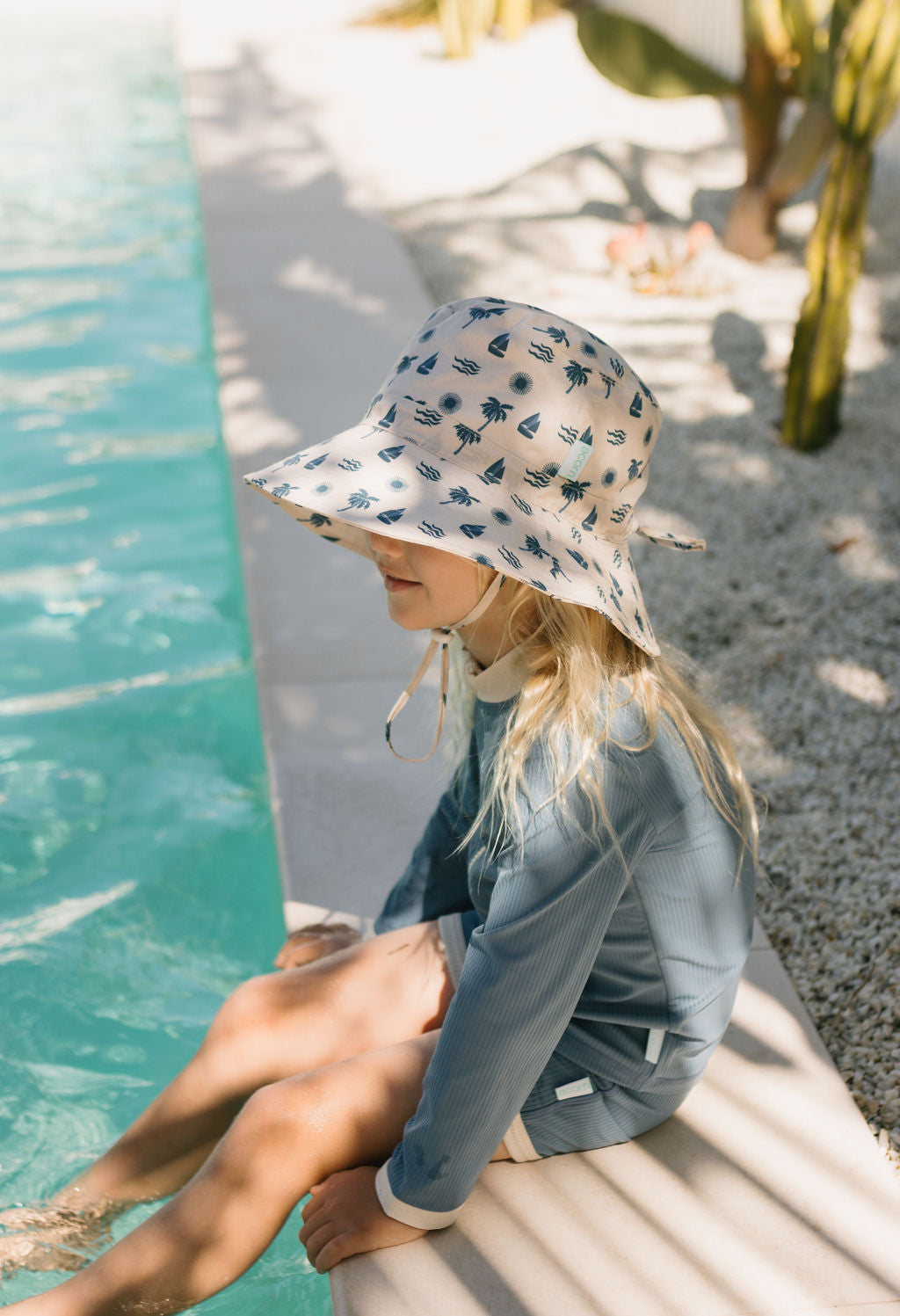 Acorn Island Breeze Wide Brim Bucket Hat - side view on model