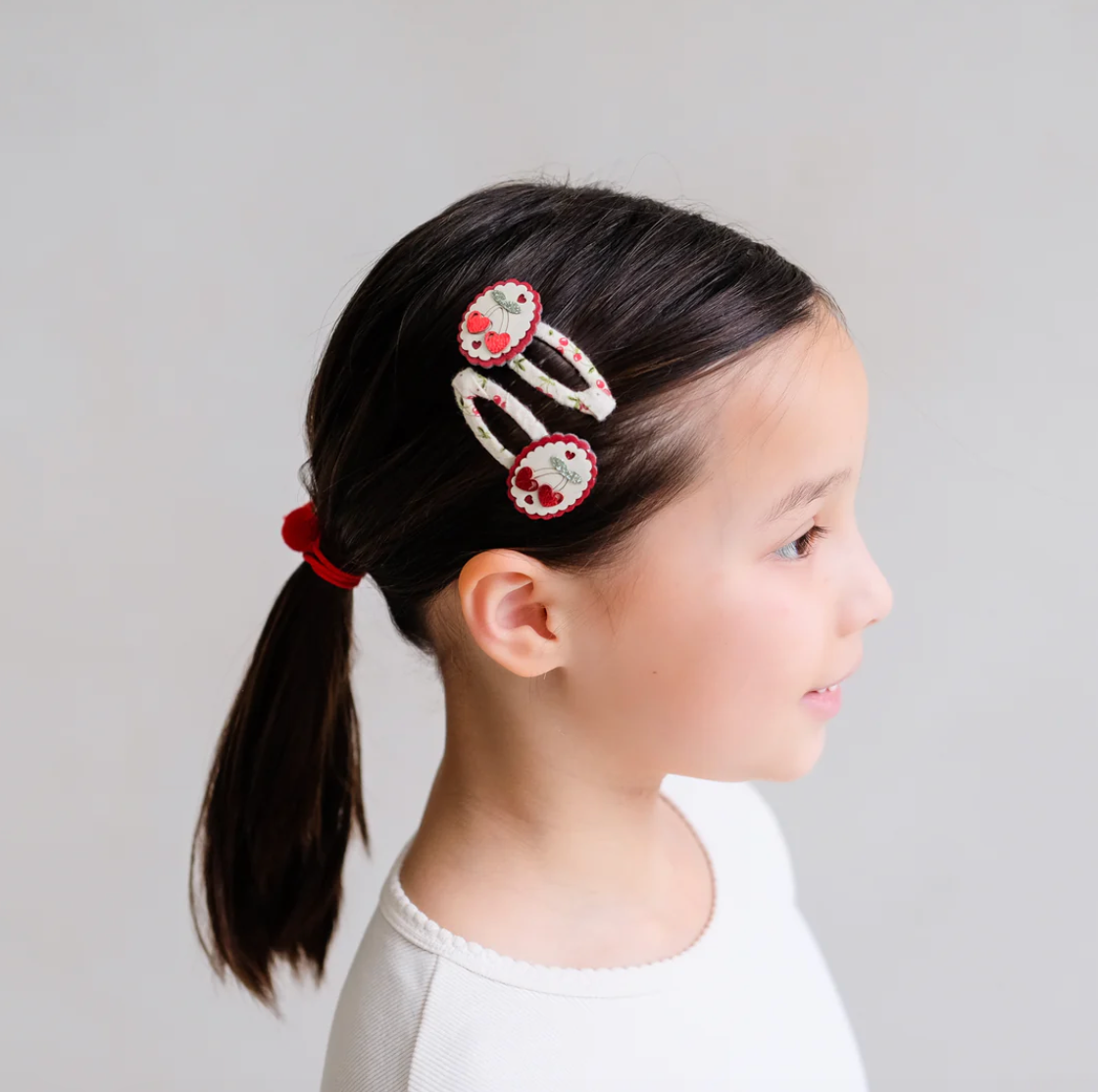 Mimi and Lula - Scallop Framed Cherry Clic Clacs — styled lifestyle shot