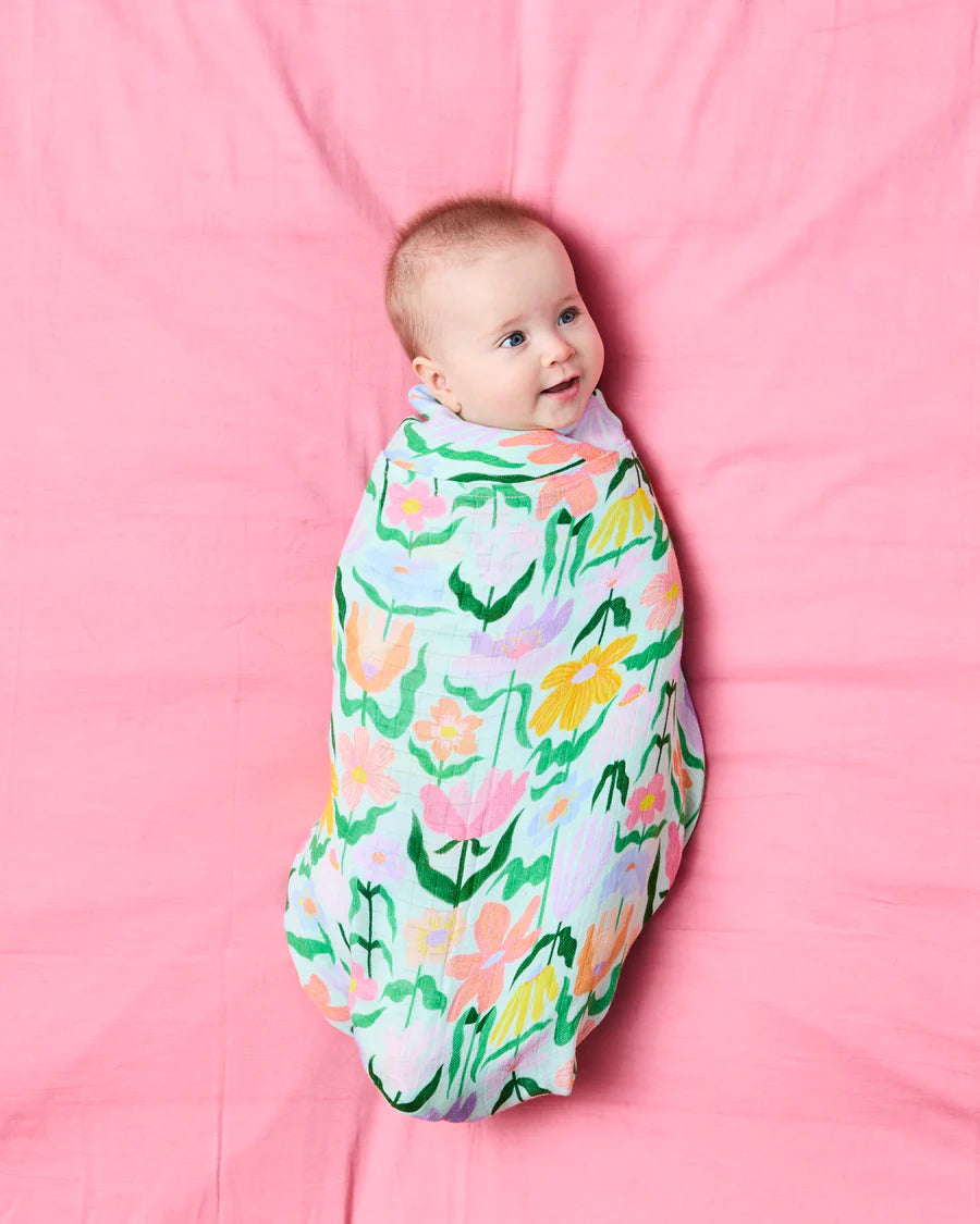 Kip and Co Popping Flowers Green Bamboo Baby Swaddle - product flatlay