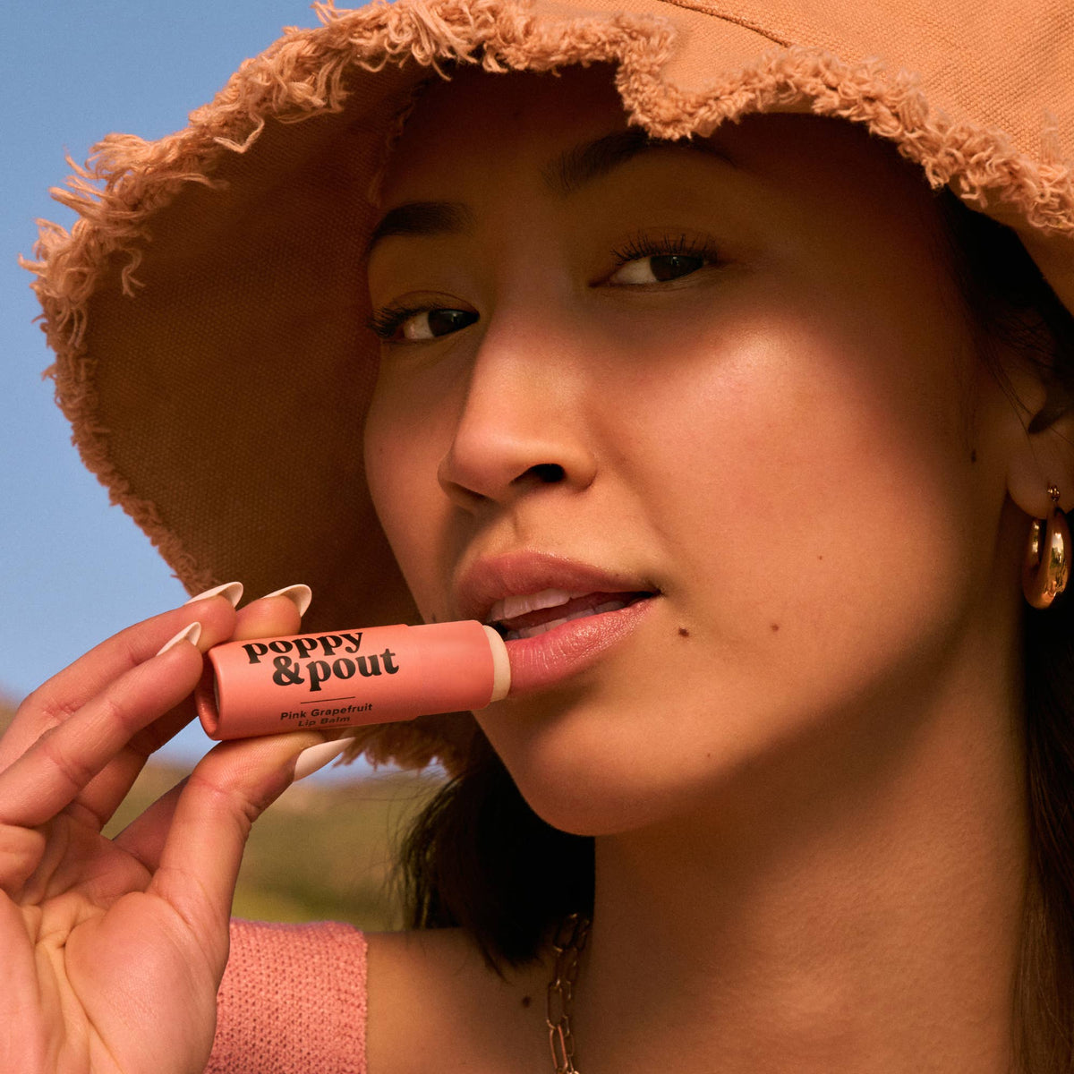 Poppy and Pout Pink Grapefruit lip balm - tube front view