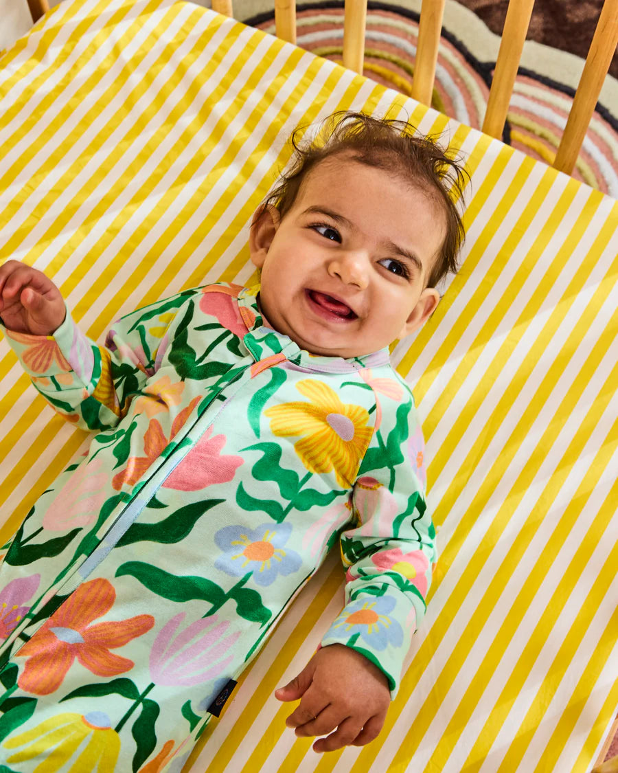 Kip and Co Popping Flowers organic romper - styled nursery shot