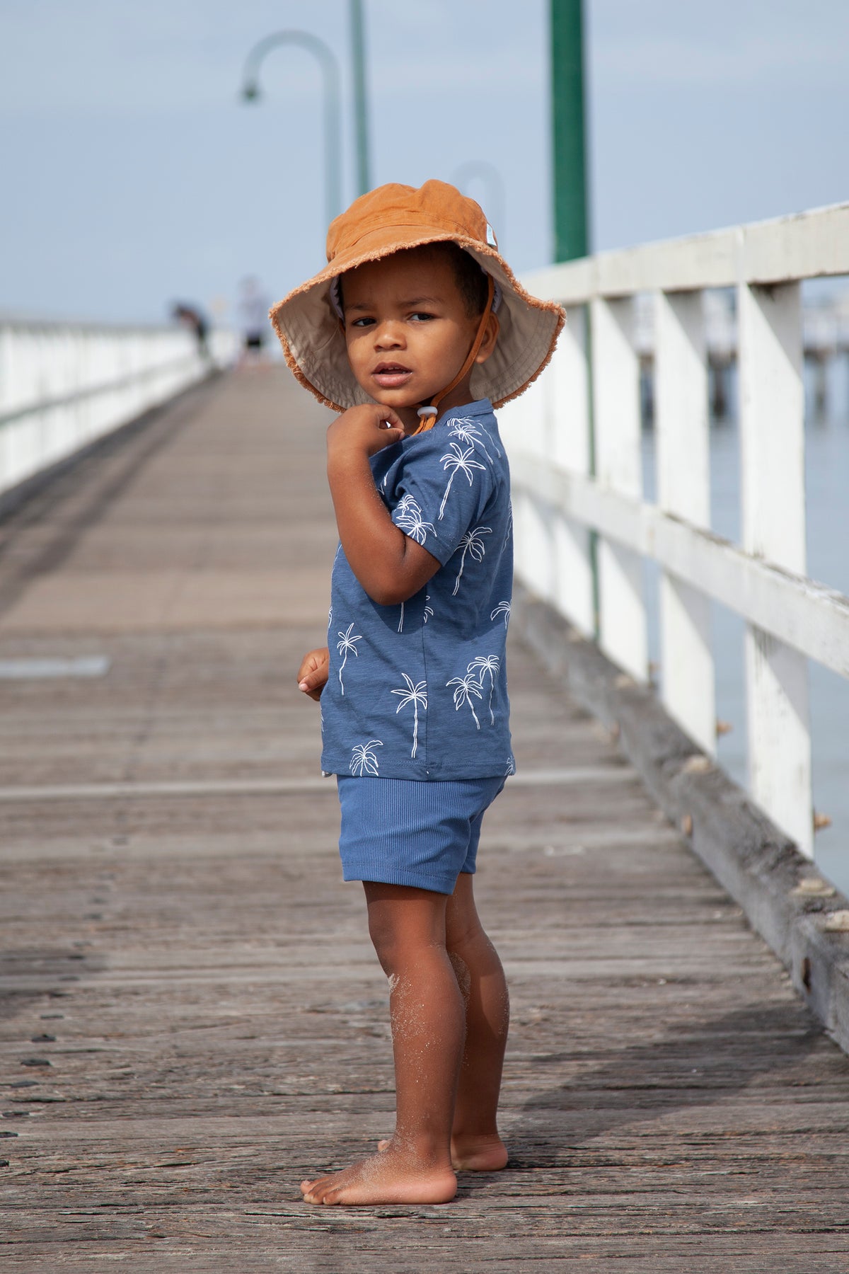 Acorn Chestnut Frayed Bucket Hat - front view on model
