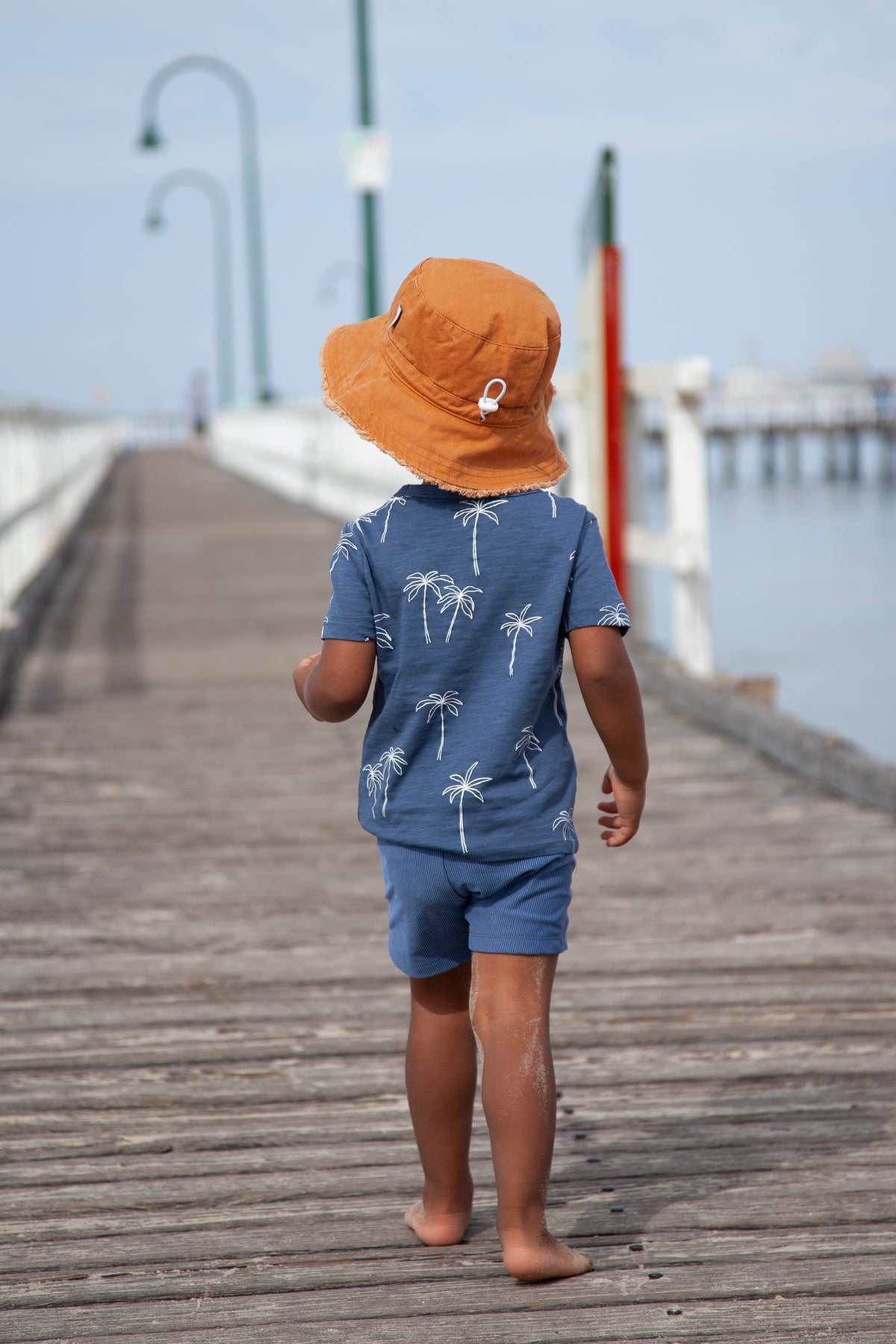 Acorn Chestnut Frayed Bucket Hat - side view on model