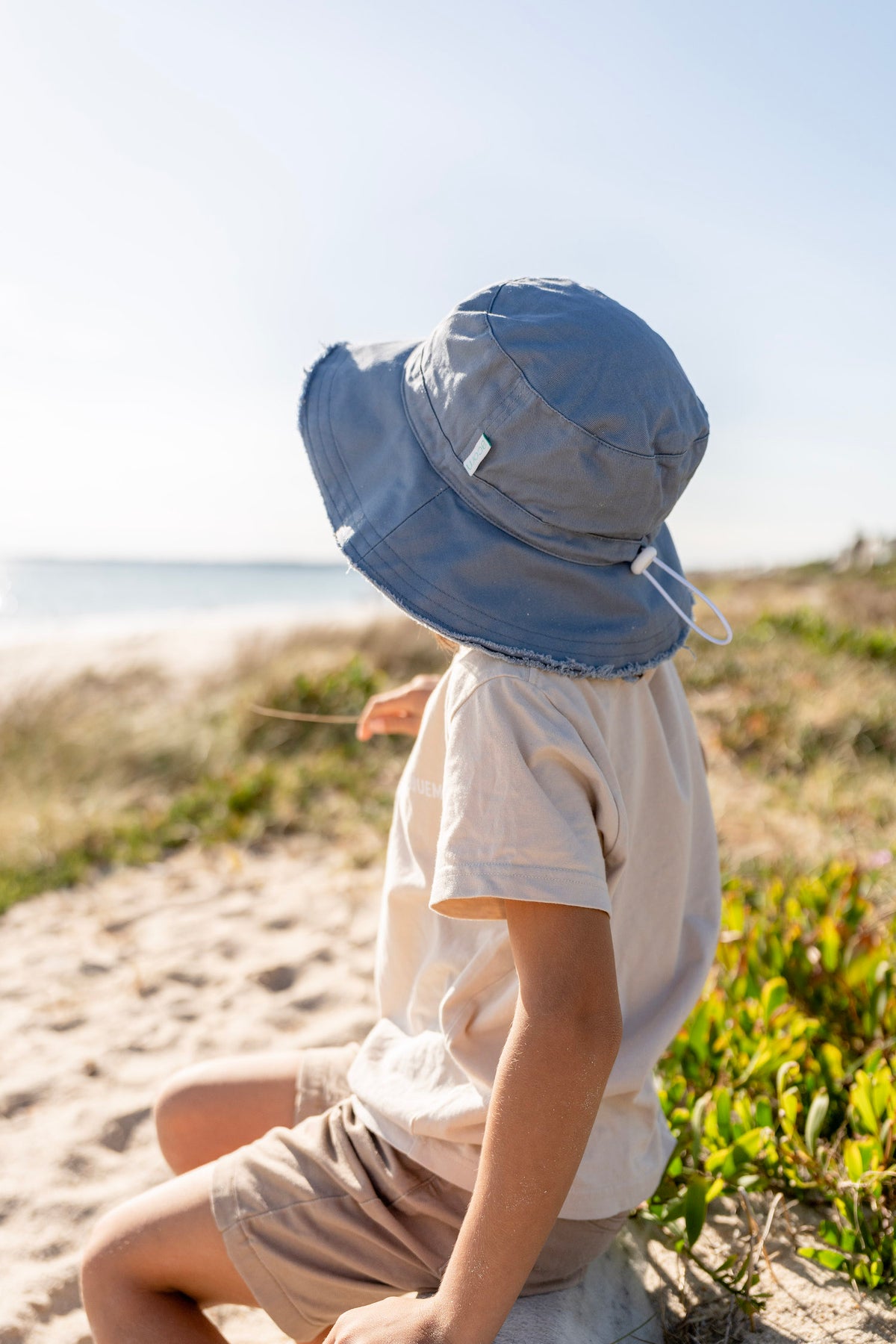 Acorn Blue Frayed Bucket Hat - front view on model