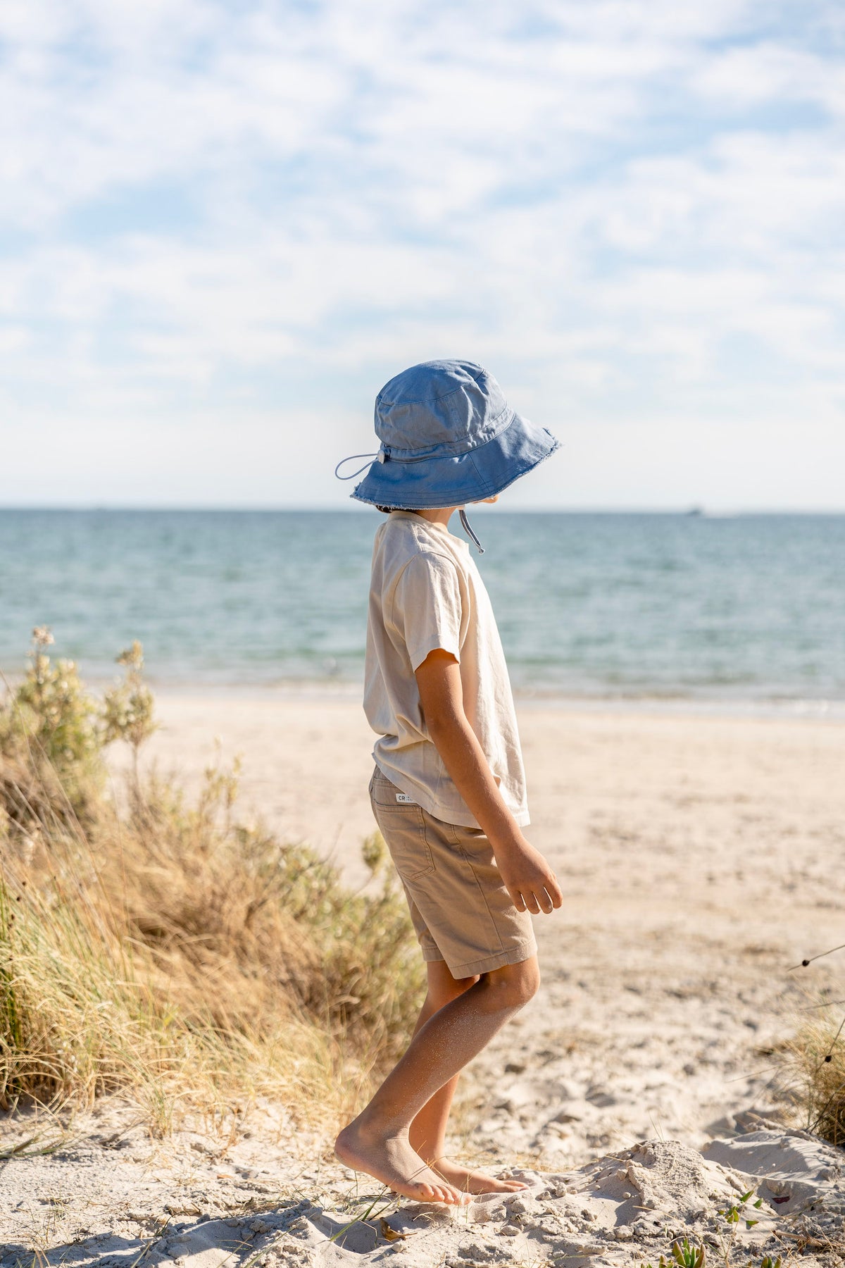 Acorn Blue Frayed Bucket Hat - side view on model