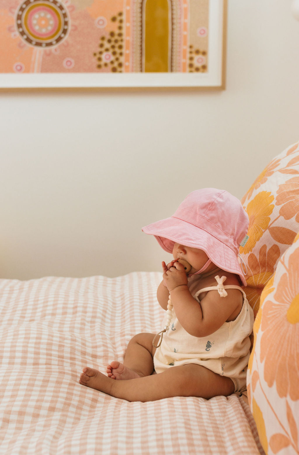 Acorn Baby Pink Wide Brim Infant Hat - front view on baby