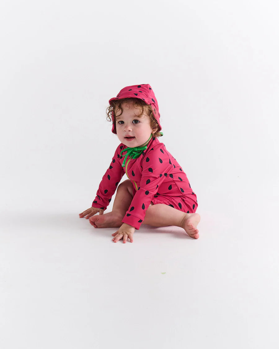 Kip and Co Melon baby swimsuit - baby wearing at beach