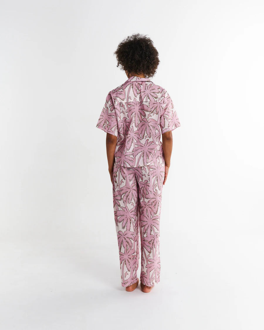 Kip and Co Balmy Palmy pyjamas - model wearing full length