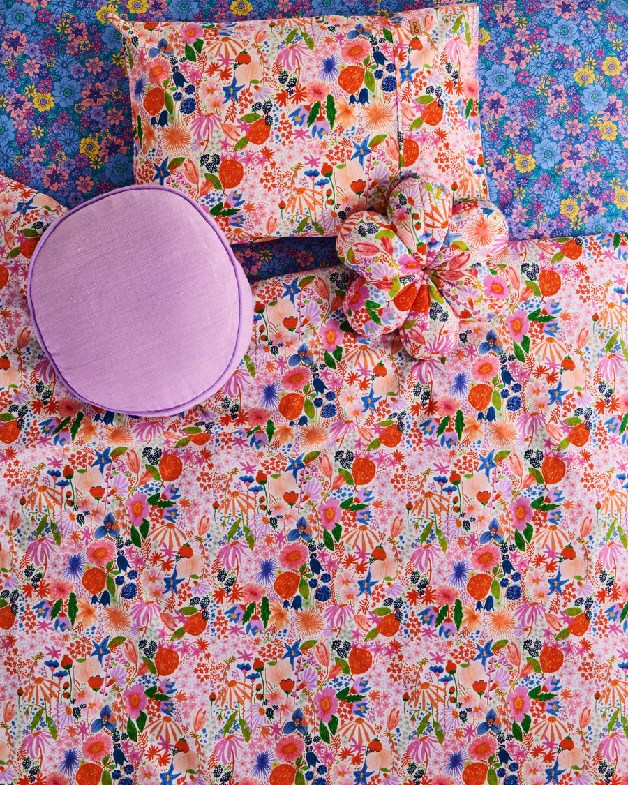 Kip and Co Meandering Meadow petal cushion - bedroom lifestyle